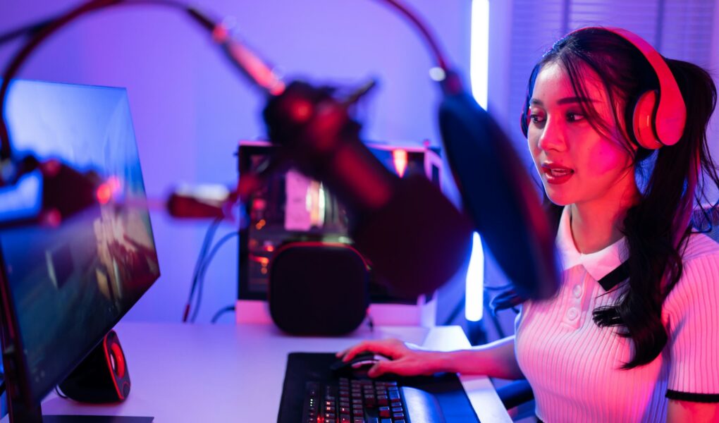 Asian beautiful Esport woman gamer play online video game on computer.