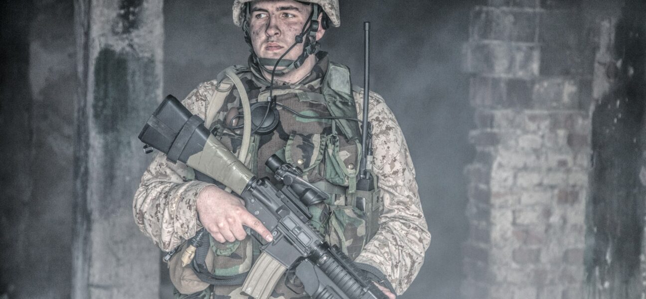 Equipped marine in combat conditions in war zone