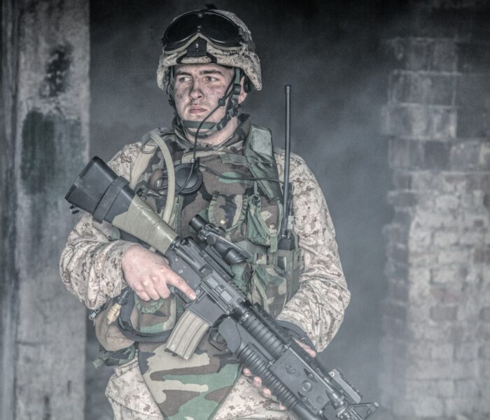 Equipped marine in combat conditions in war zone